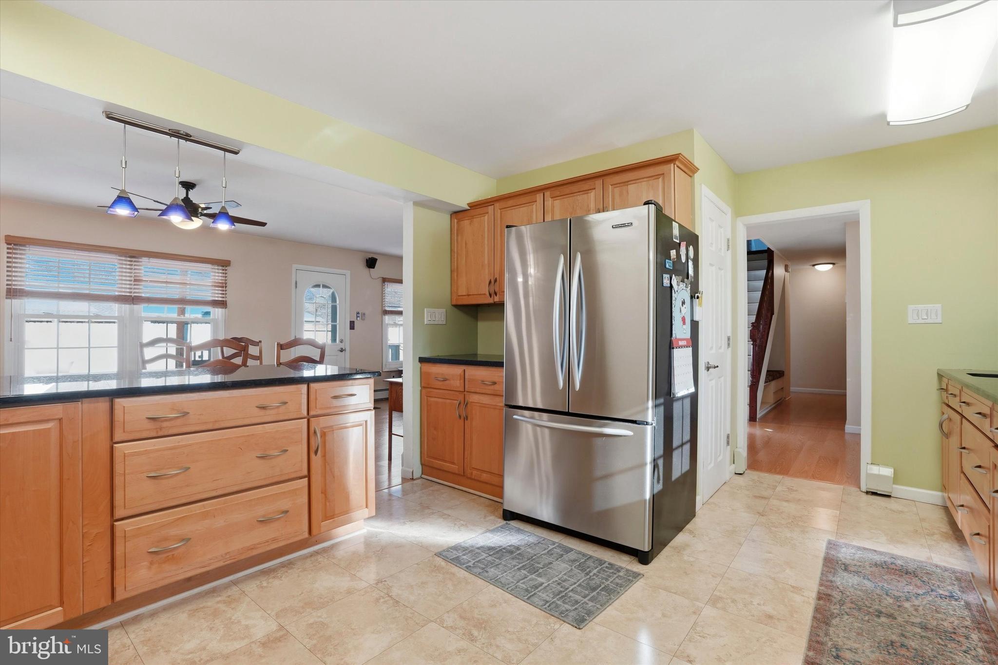 28 Sycamore Road Levittown, PA 19056 - Photo 8 of 31 a kitchen with granite countertop stainless steel appliances a refrigerator and cabinets
