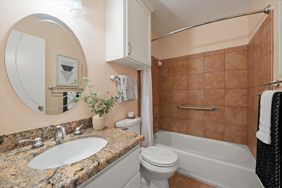 10919 Coloma Road, Unit 2 Rancho Cordova, CA 95670 - Photo 27 of 34 Upstairs full bath with granite countertop and travertine tiles.
