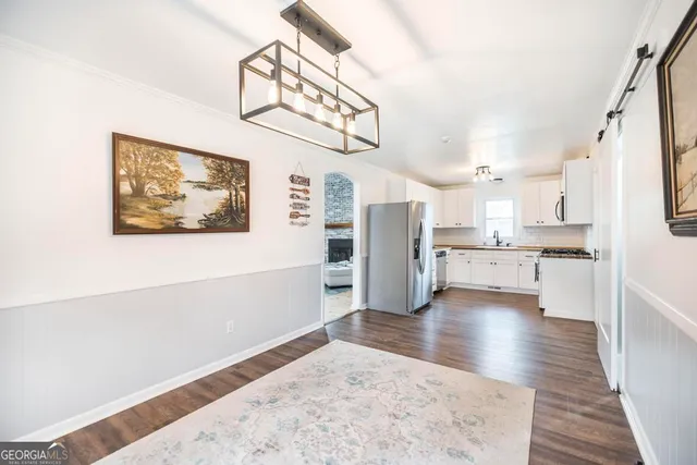 a view of kitchen with furniture and wooden floor