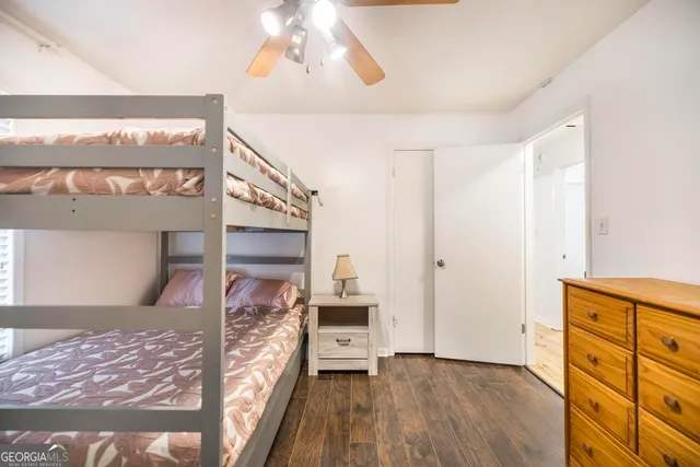 a view of a hallway view with furniture and wooden floor