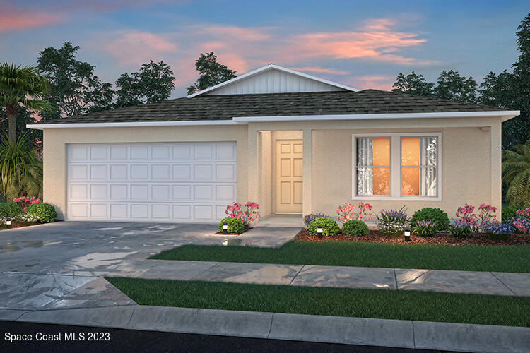 a front view of a house with a yard and potted plants