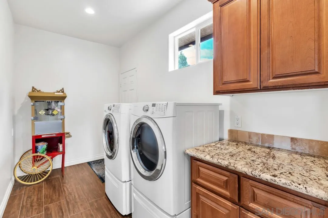 352 Sneath Way Alpine, CA 91901 - Photo 22 of 50 a utility room with dryer and washer