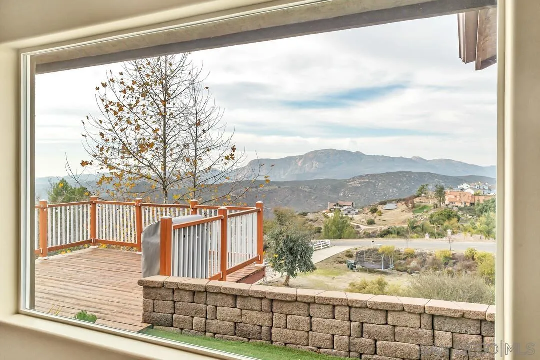 352 Sneath Way Alpine, CA 91901 - Photo 8 of 50 a view of a porch with a floor to ceiling window