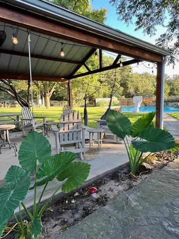 a view of a swimming pool with a patio