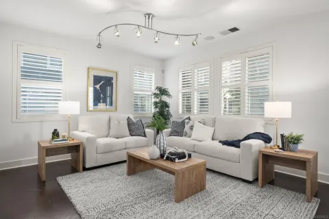 a living room with furniture and a large window