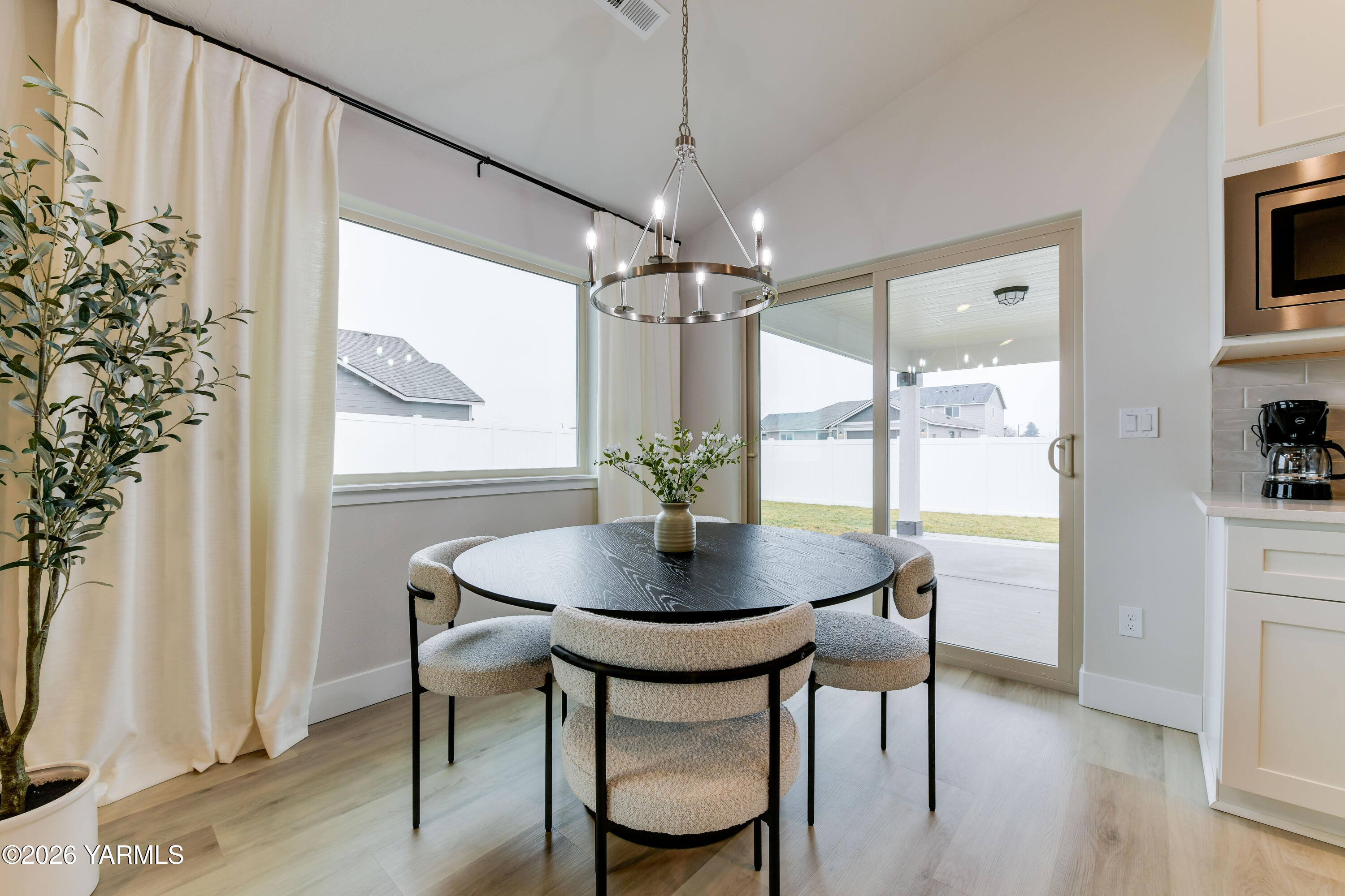 903 North Euclid Road, Unit PHASE 1 LOT 8) SPEC Grandview, WA 98930 - Photo 14 of 25 a view of a dining room with furniture window and wooden floor