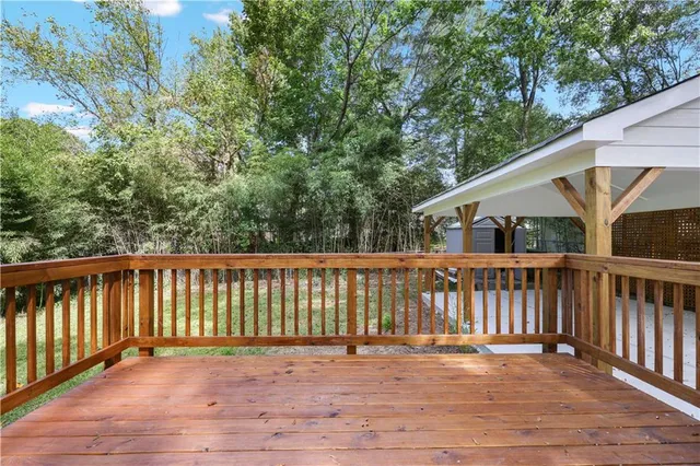a view of deck with wooden floor and seating space