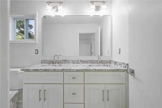a view of an empty room and wooden floor