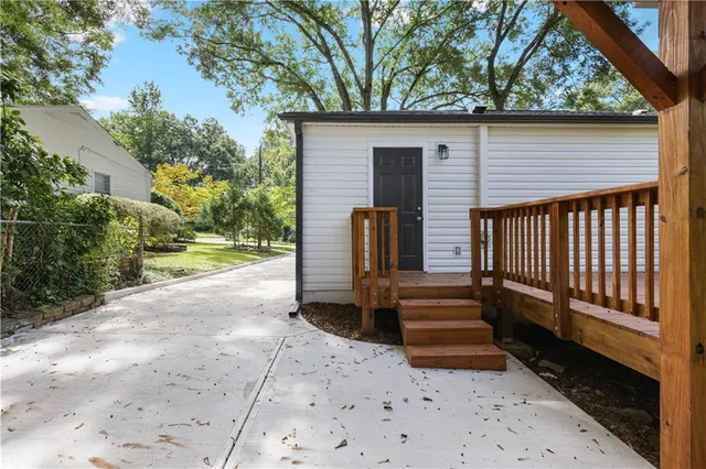 a stove top oven sitting inside of a kitchen