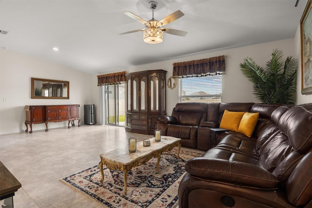 287 Inman Boulevard Winter Haven, FL 33881 - Photo 18 of 36 a living room with furniture and a large window