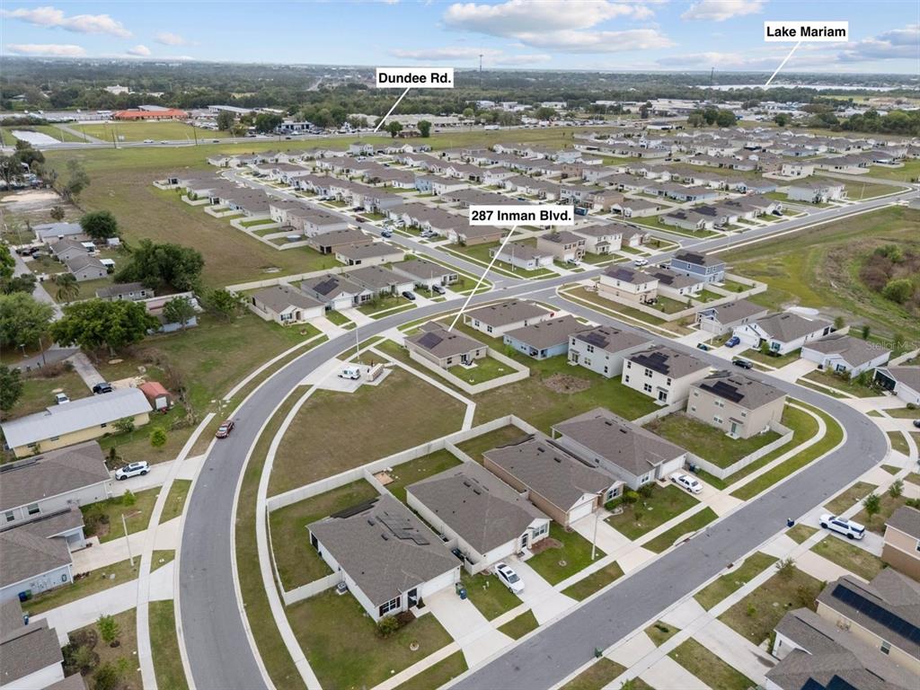 287 Inman Boulevard Winter Haven, FL 33881 - Photo 28 of 36 an aerial view of residential houses with outdoor space