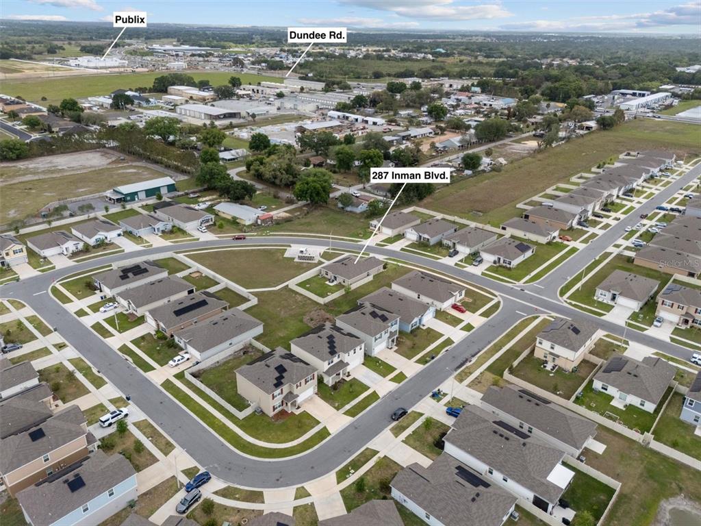 287 Inman Boulevard Winter Haven, FL 33881 - Photo 29 of 36 an aerial view of residential building with parking space