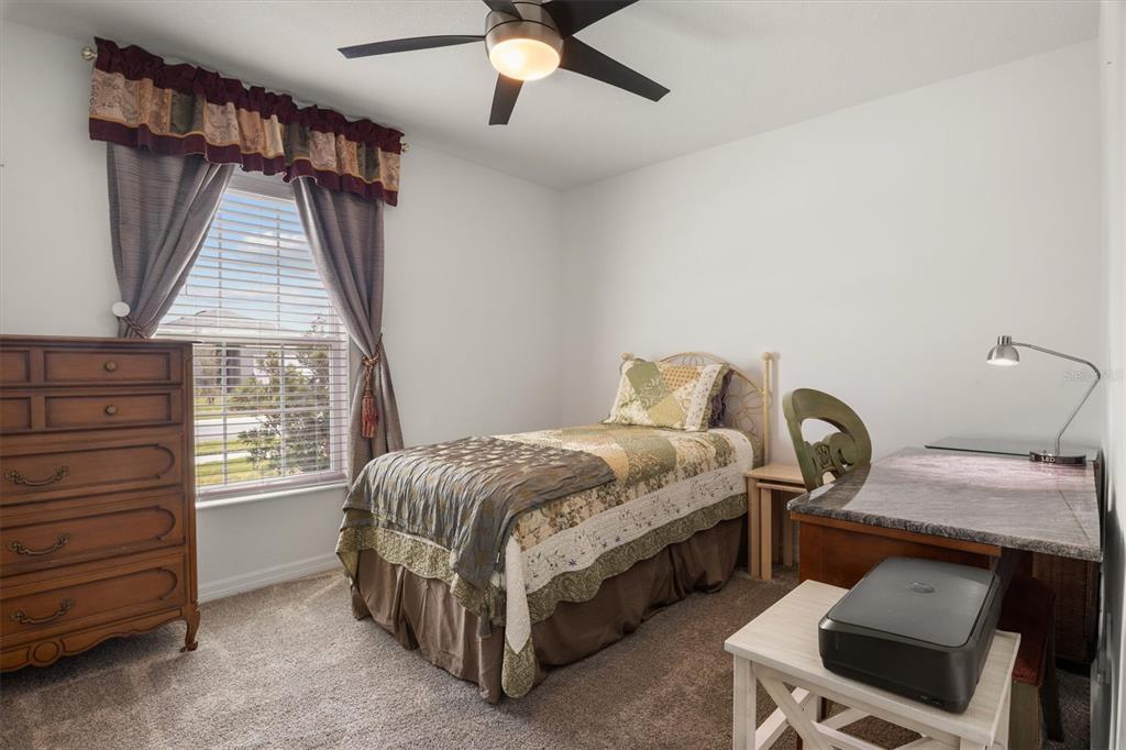 287 Inman Boulevard Winter Haven, FL 33881 - Photo 6 of 36 a bedroom with a bed and a window