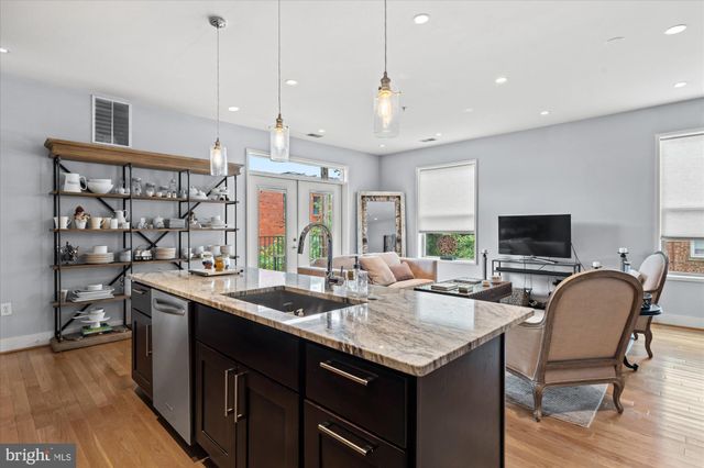 a very nice looking dining room with a table and chairs