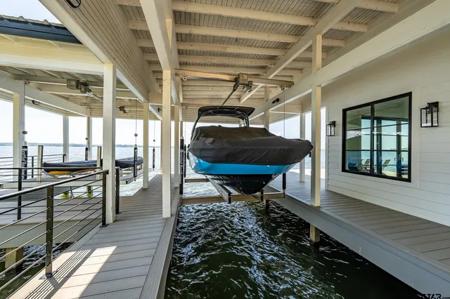 a view of balcony with two chairs and wooden floor