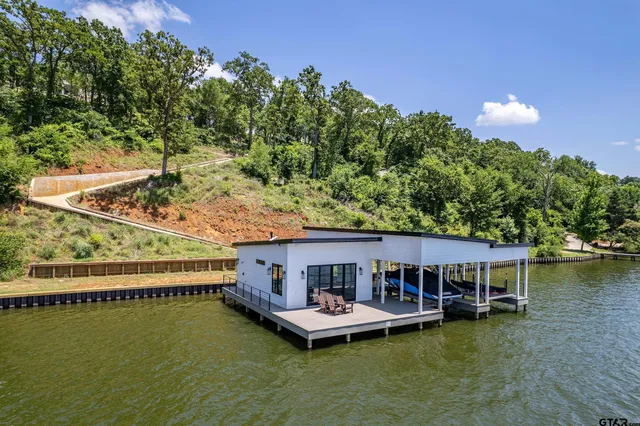 a view of a balcony with two chairs