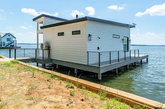 an aerial view of a house with a yard and garden