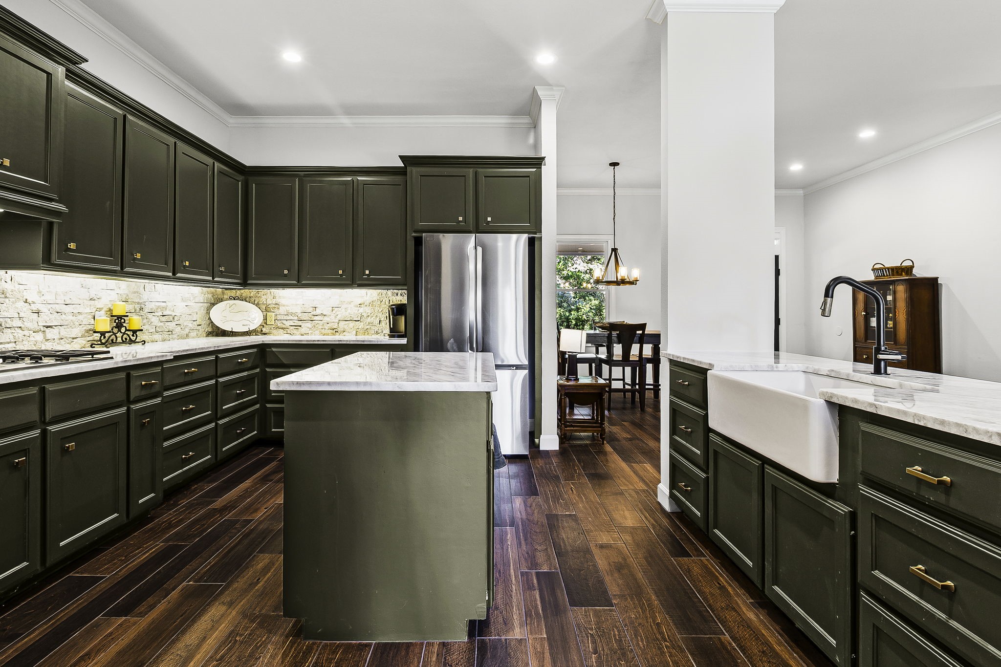 1387 Barrett's Landing Road Trinity, TX 75862 - Photo 15 of 50 a kitchen with stainless steel appliances granite countertop a refrigerator a sink dishwasher a stove and white countertops with wooden floor