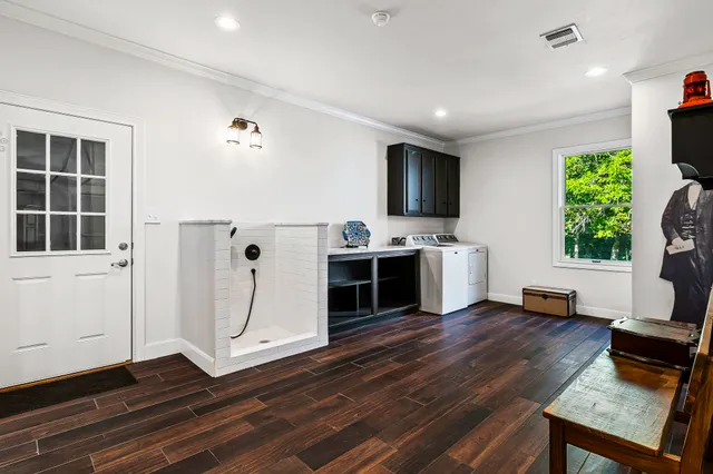 a living room with a flat screen tv and a fireplace