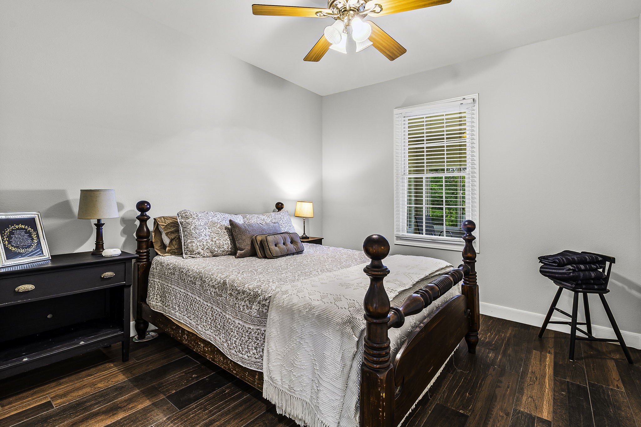 1387 Barrett's Landing Road Trinity, TX 75862 - Photo 19 of 50 a bedroom with a bed and a chandelier