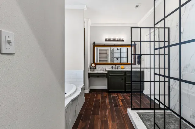 a kitchen with stainless steel appliances granite countertop a stove and a refrigerator