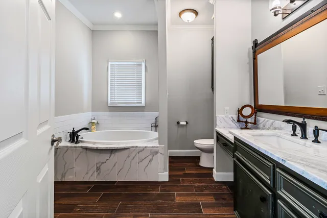 a bathroom with a double vanity sink and a mirror