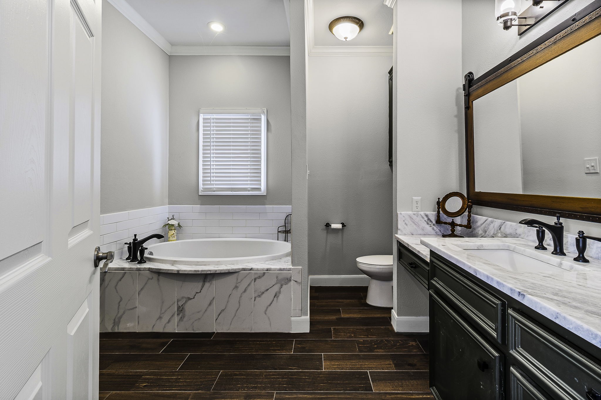 1387 Barrett's Landing Road Trinity, TX 75862 - Photo 26 of 50 a bathroom with a double vanity sink and a mirror