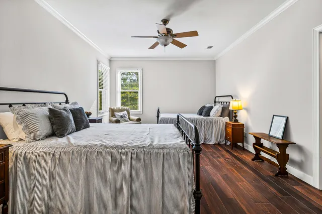 a bedroom with bed and window
