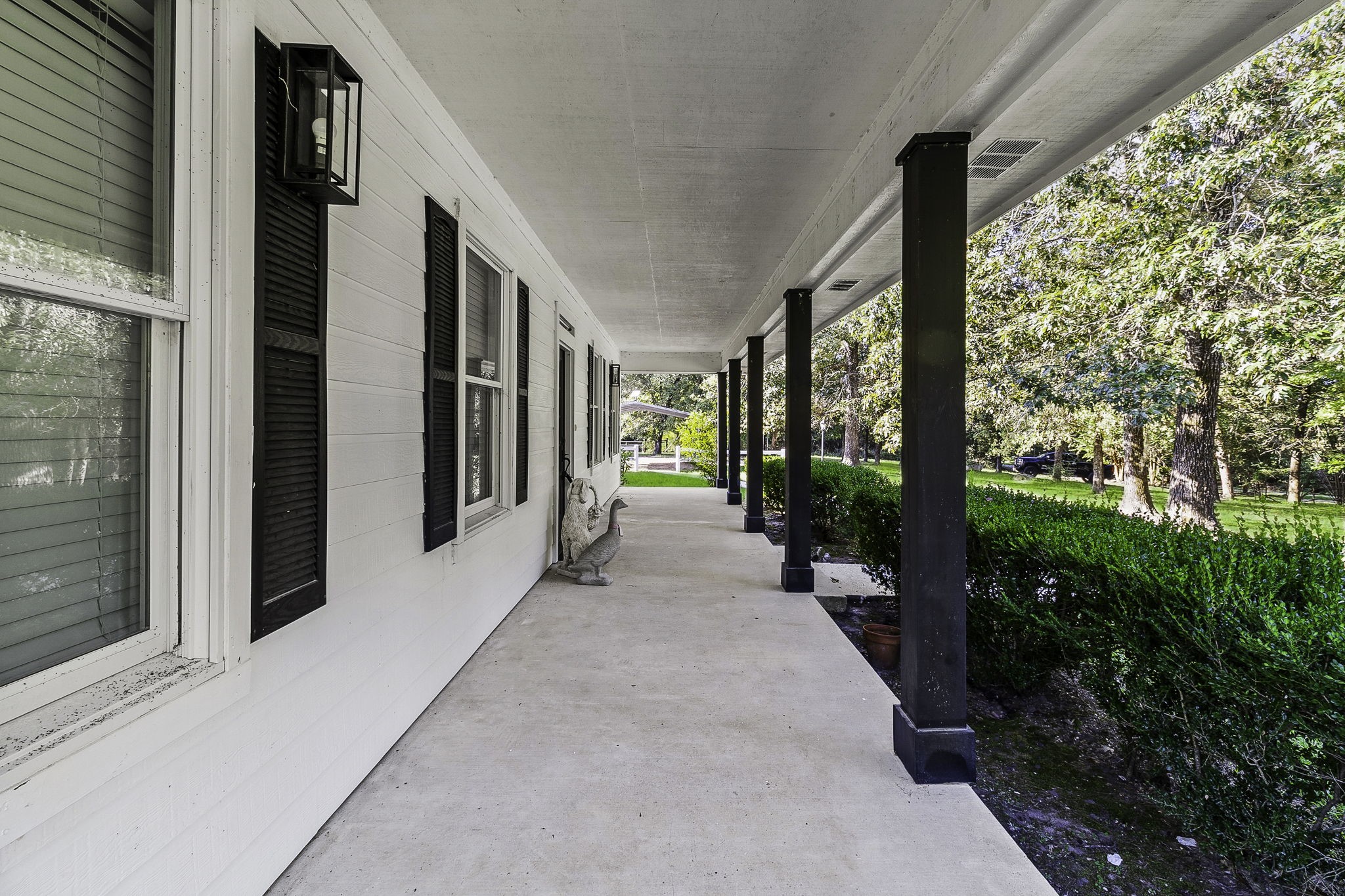 1387 Barrett's Landing Road Trinity, TX 75862 - Photo 3 of 50 a view of a garden from a porch
