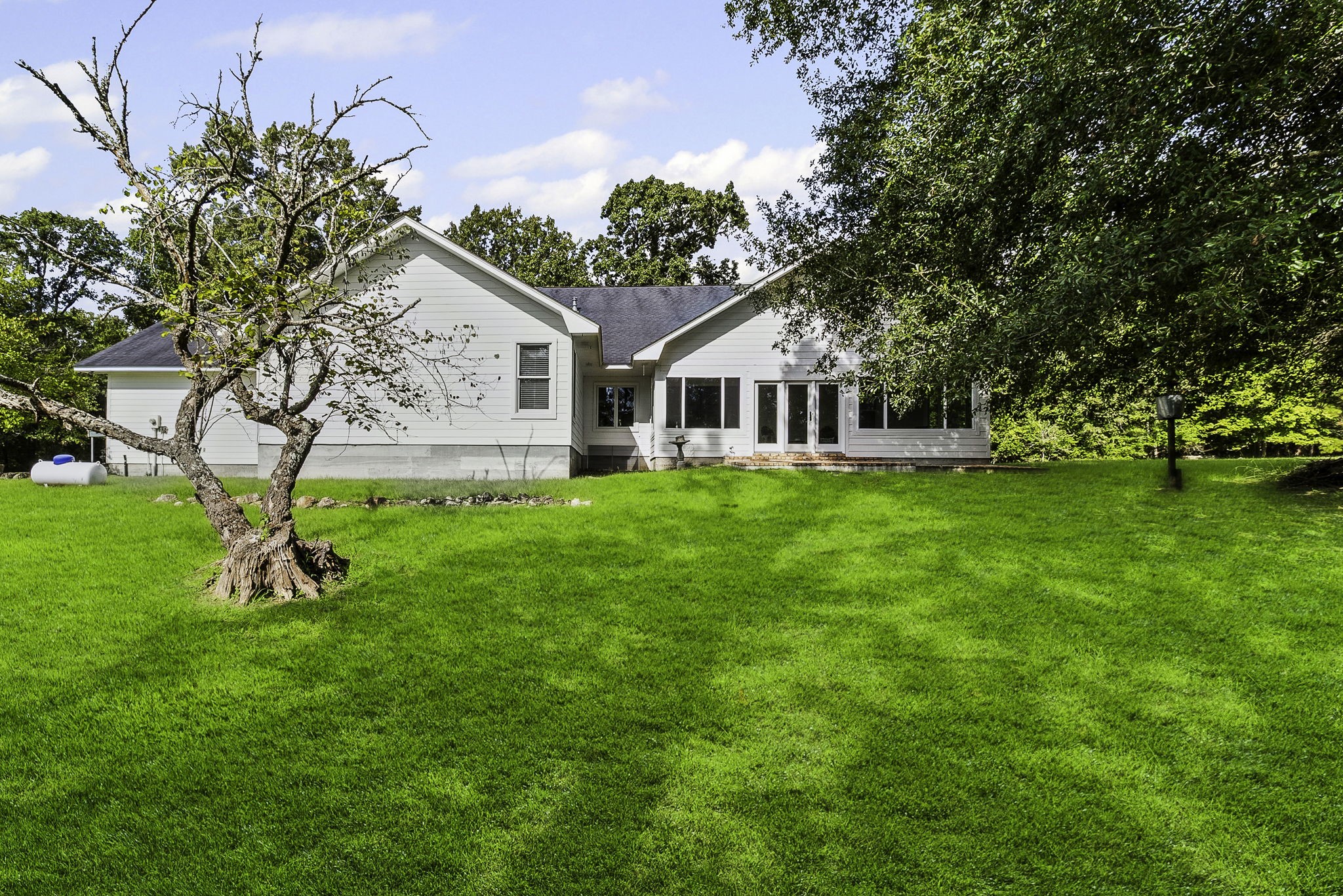 1387 Barrett's Landing Road Trinity, TX 75862 - Photo 34 of 50 a view of a house with a yard and sitting area