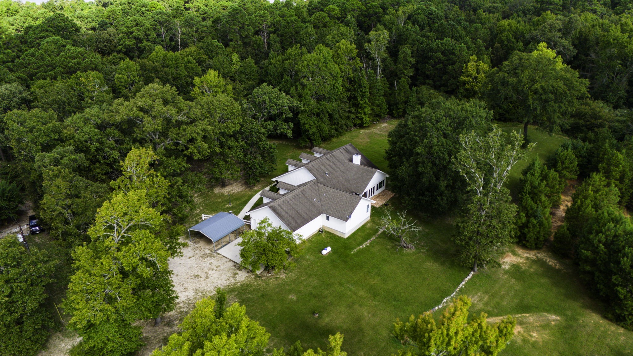1387 Barrett's Landing Road Trinity, TX 75862 - Photo 36 of 50 an aerial view of residential houses with outdoor space and trees all around