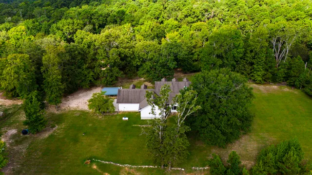 a backyard of a house with lots of green space