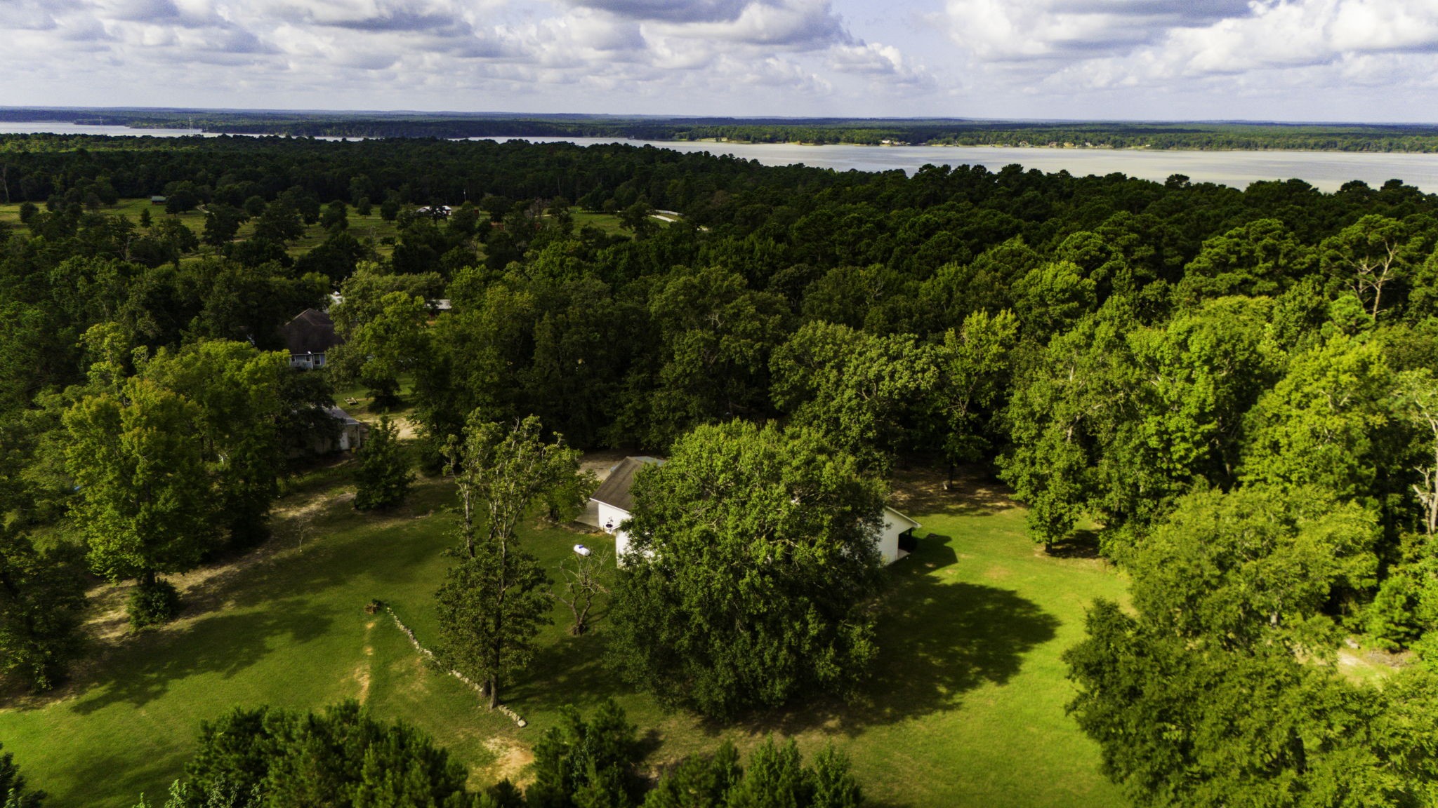 1387 Barrett's Landing Road Trinity, TX 75862 - Photo 39 of 50 a view of a lake with houses