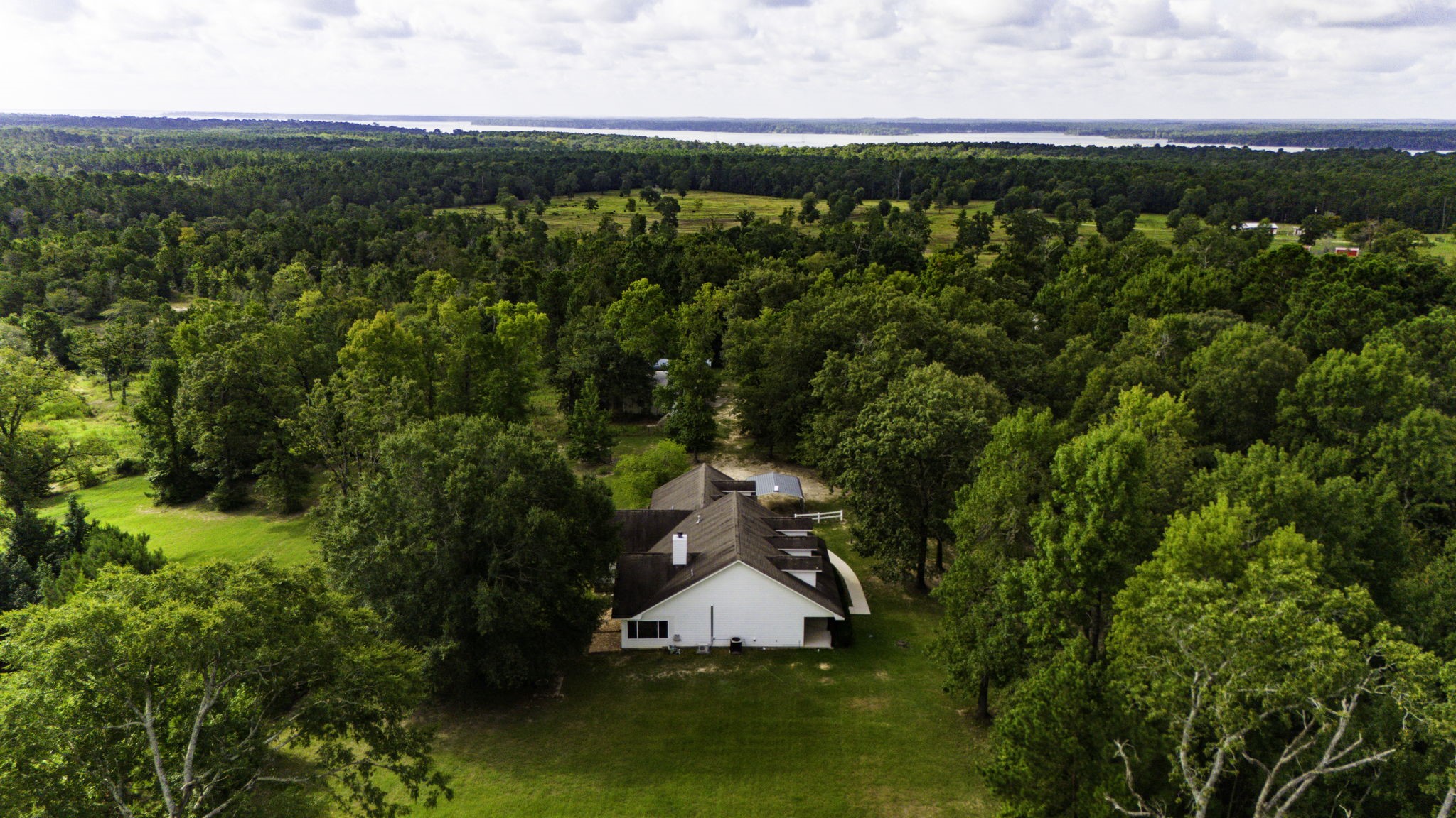 1387 Barrett's Landing Road Trinity, TX 75862 - Photo 40 of 50 an aerial view of a house with a yard and lake view