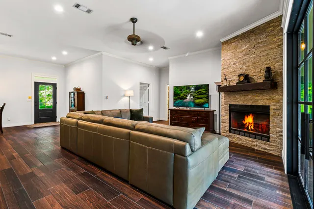 a living room with furniture and a fireplace