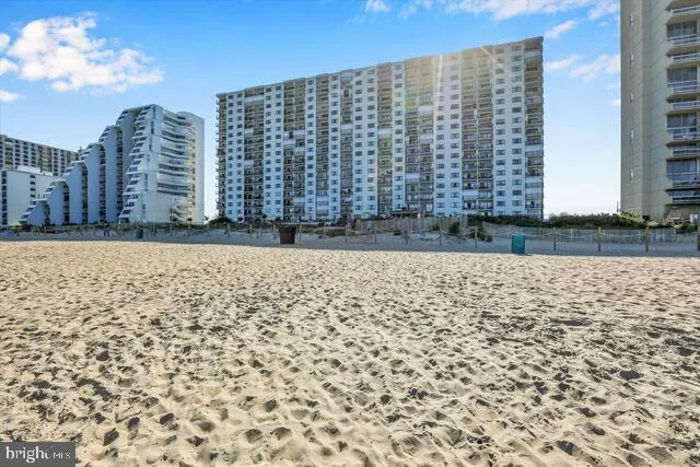a view of a building with a yard