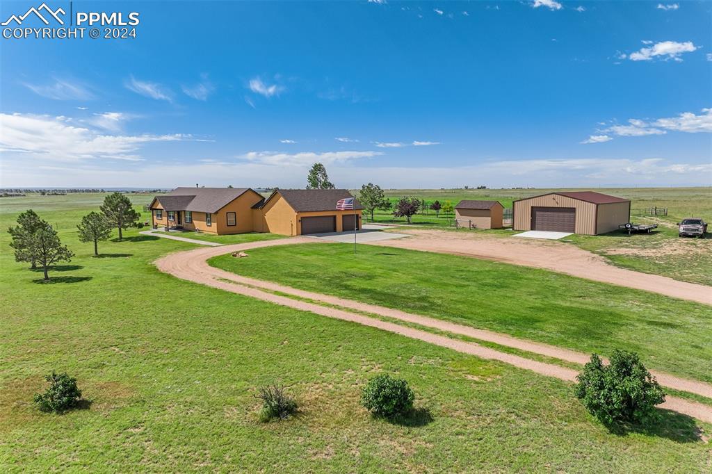 21445 Scott Road Calhan, CO 80808 - Photo 1 of 50 a view of a house with a yard