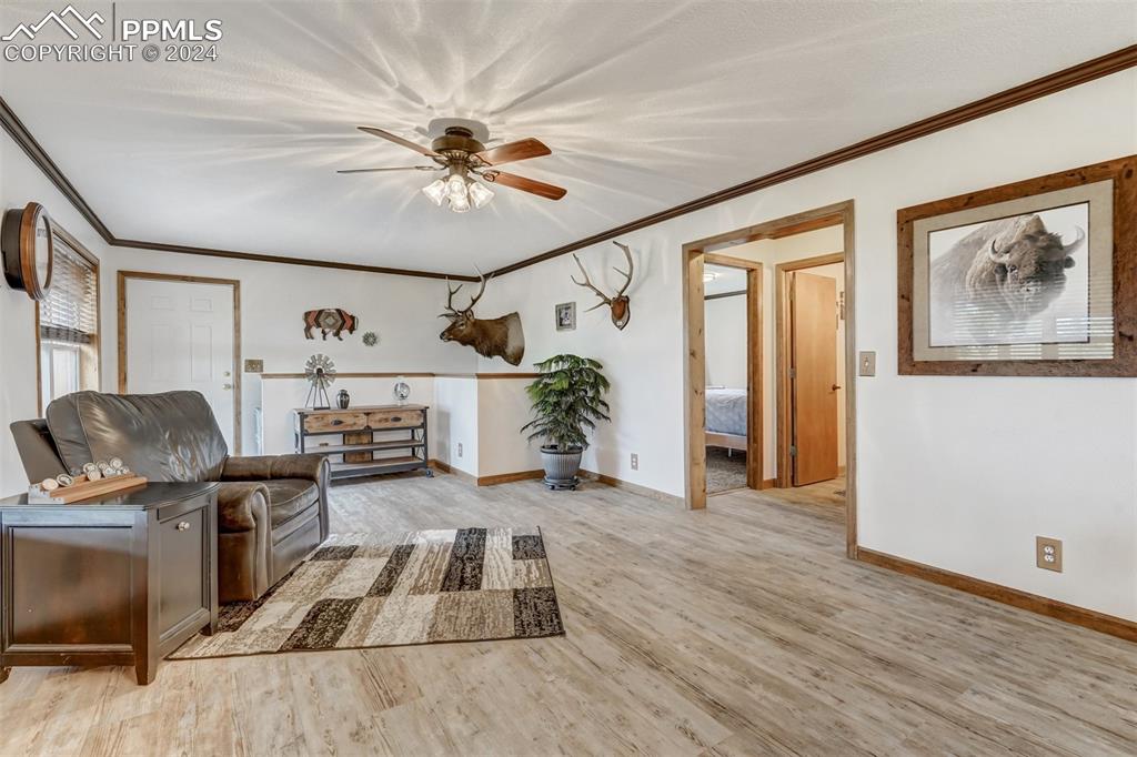 21445 Scott Road Calhan, CO 80808 - Photo 11 of 50 a living room with furniture and wooden floor