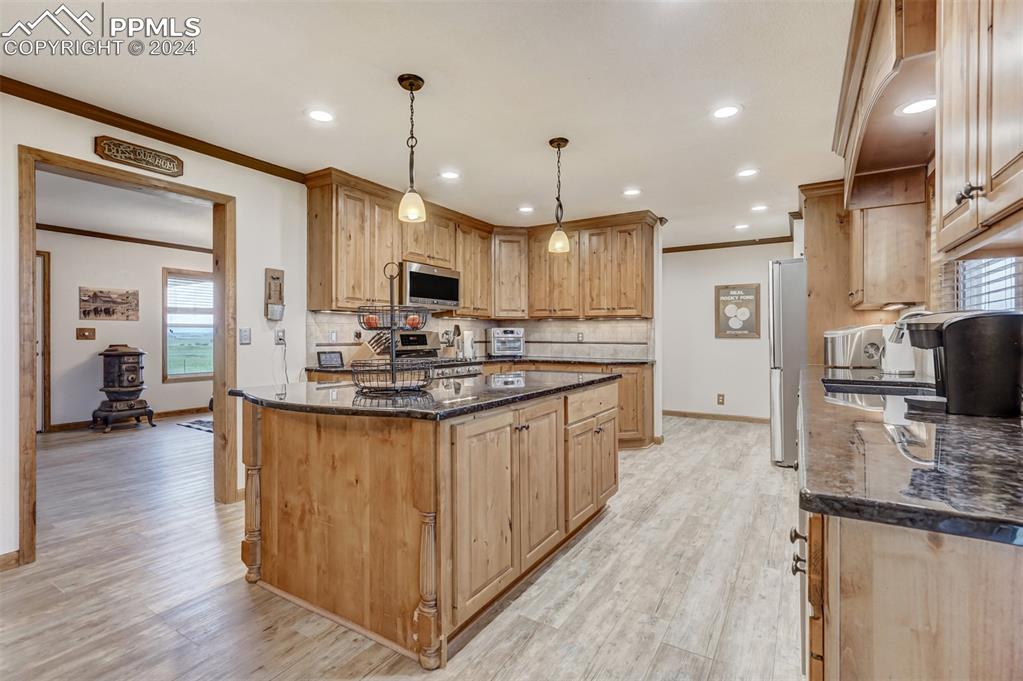 21445 Scott Road Calhan, CO 80808 - Photo 14 of 50 a kitchen with stainless steel appliances granite countertop a sink refrigerator and cabinets