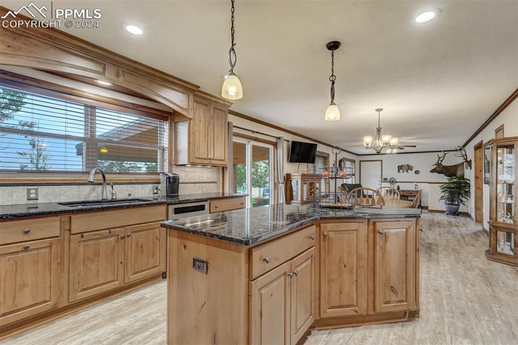 21445 Scott Road Calhan, CO 80808 - Photo 15 of 50 a kitchen with lots of counter space and a sink