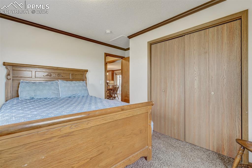 21445 Scott Road Calhan, CO 80808 - Photo 25 of 50 a bedroom with a bed and a window