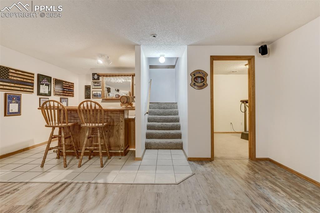 21445 Scott Road Calhan, CO 80808 - Photo 27 of 50 a view of a livingroom with wooden floor and chair