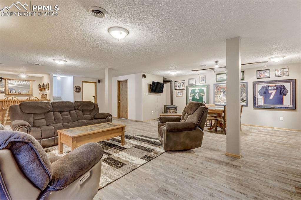 21445 Scott Road Calhan, CO 80808 - Photo 30 of 50 a living room with furniture and a wooden floor