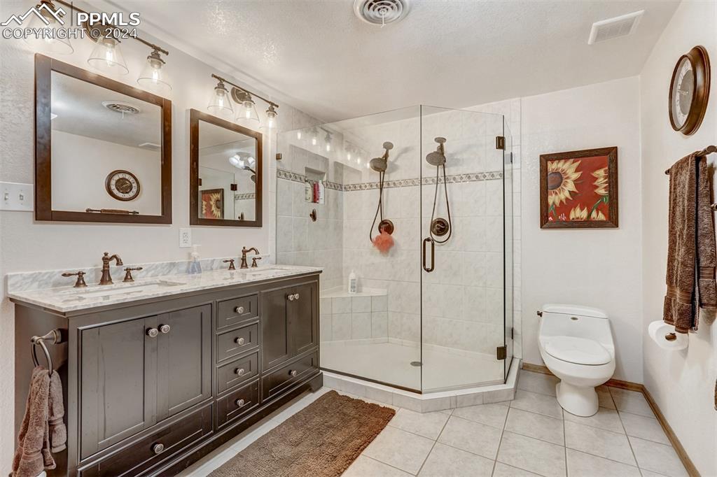 21445 Scott Road Calhan, CO 80808 - Photo 36 of 50 a spacious bathroom with a toilet sink and shower