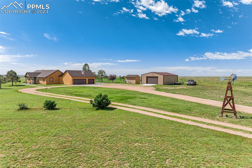 21445 Scott Road Calhan, CO 80808 - Photo 4 of 50 a view of yard with swimming pool and green space
