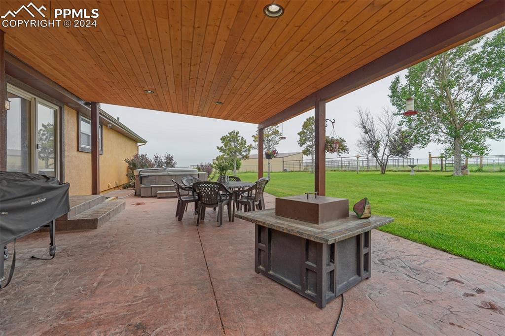 21445 Scott Road Calhan, CO 80808 - Photo 46 of 50 a outdoor space with lots of chairs and plants