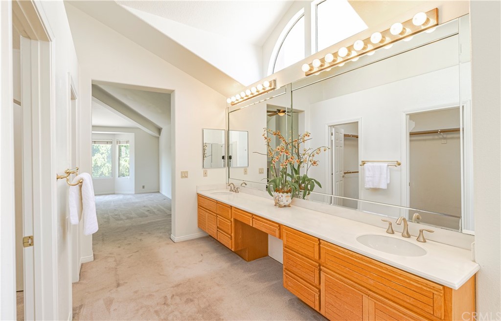 2132 Burnt Mill Road Tustin, CA 92782 - Photo 11 of 21 a spacious bathroom with a double vanity sink a mirror and a shower