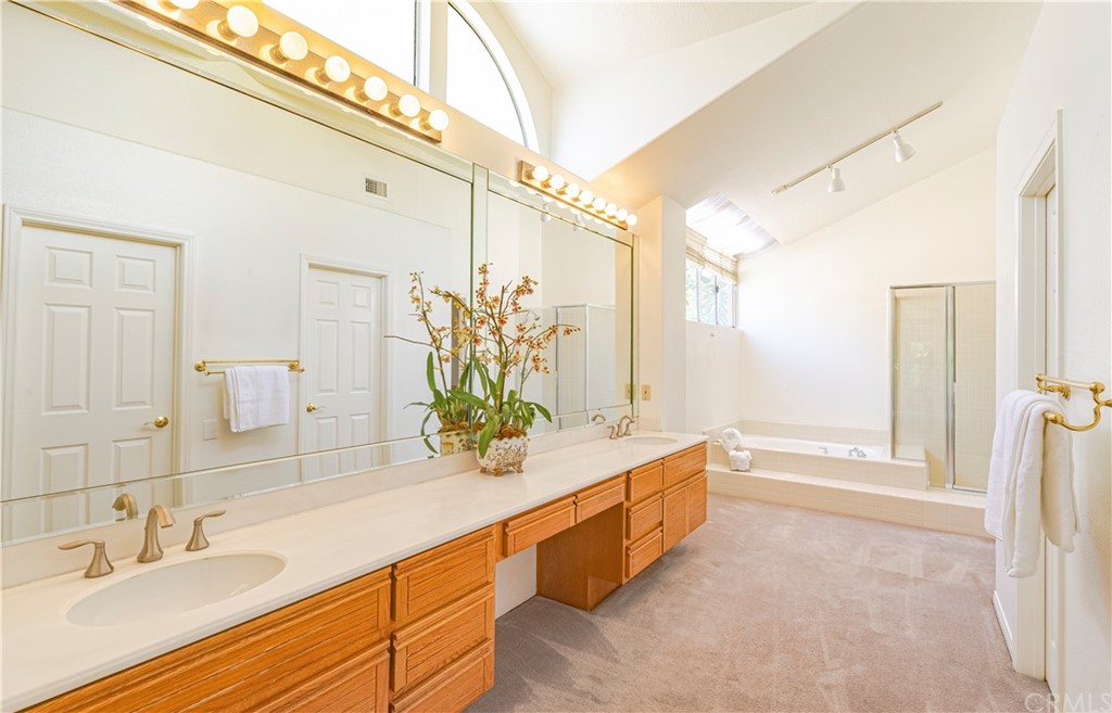 2132 Burnt Mill Road Tustin, CA 92782 - Photo 12 of 21 a spacious bathroom with a double vanity sink a large mirror and shower