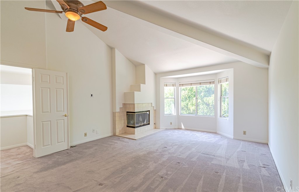 2132 Burnt Mill Road Tustin, CA 92782 - Photo 8 of 21 a view of a livingroom with a ceiling fan and window