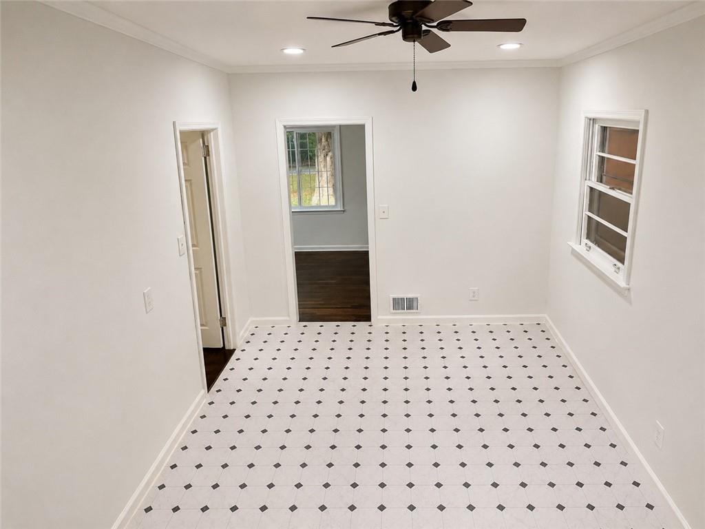 1189 Rock Cut Road Forest Park, GA 30297 - Photo 15 of 23 a bedroom with a bed and a dresser